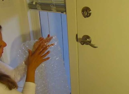 This woman covers her windows in bubble wrap for cheap window insulation. Seems to work well!