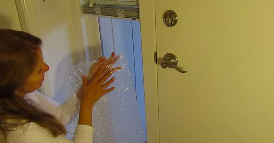 This woman covers her windows in bubble wrap for cheap window insulation. Seems to work well!