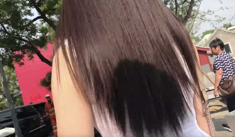 Watch two girls attempt to scam an undercover tourist in Beijing – Scam School